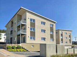 Fertighaus Mehrfamilienhaus in Oberrot von Fertighaus WEISS - Mehrfamilienhäuser, Pultdachhaus Außenansicht 2