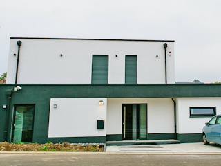 Massivhaus Stylisches Flachdachhaus von RheinMassiv Massivhäuser, Cubushaus Außenansicht 3