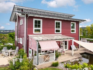 Fertighaus E 20-168.1 - Fertighaus im skandinavischen Landhausstil & Hampton-Flair von SchwörerHaus, Außenansicht 1